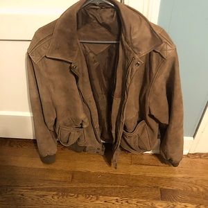Brown leather Jacket with satin inside. Tons of pockets. Comfortable and warm.